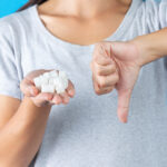 world-diabetes-day-hand-holding-sugar-cubes-thumb-down-another-hand (1)